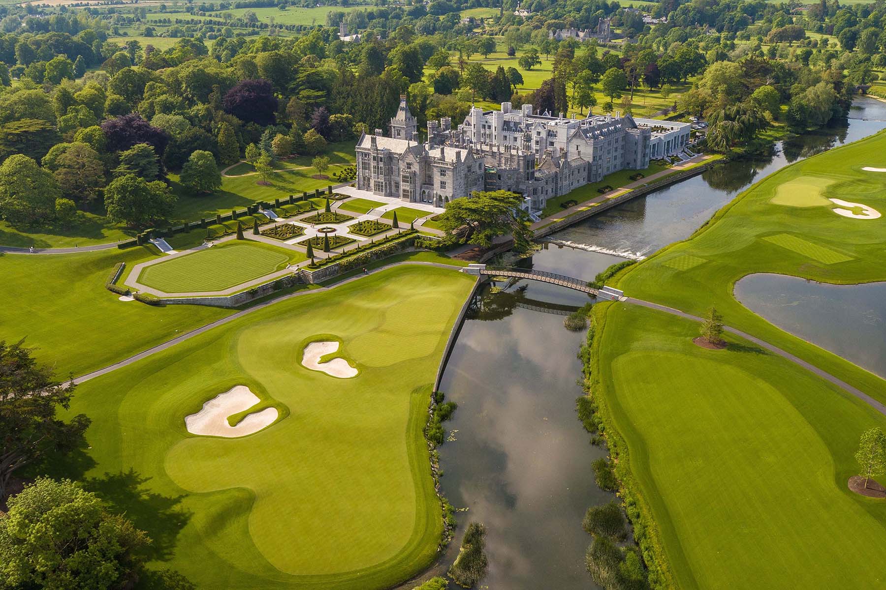 Aerial view of Adare Manor's castle, river and golf course, Co. Limerick