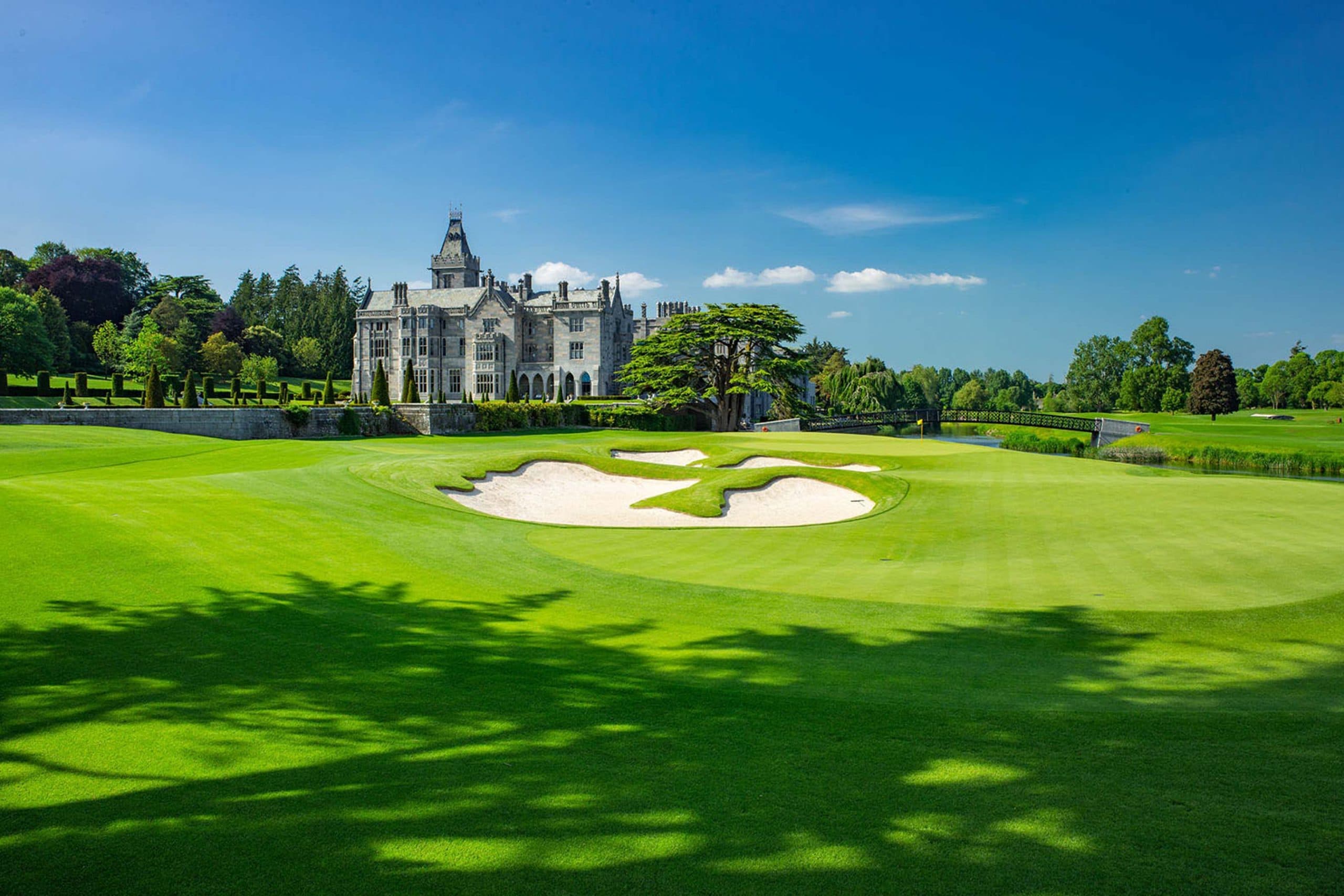 Green and bunkers at Adare Manor with the castle beyond